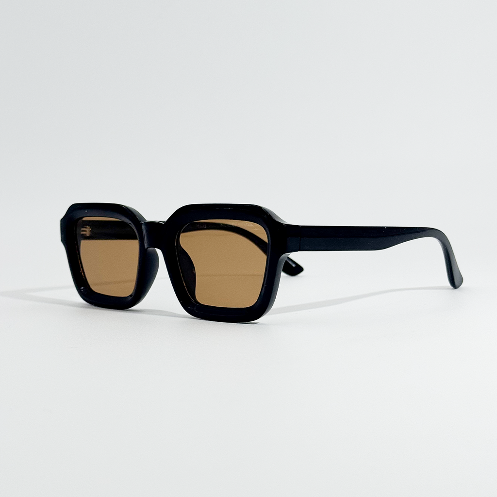 Amber Noir black square sunglasses with brown UV400 lenses, angled on a white background.