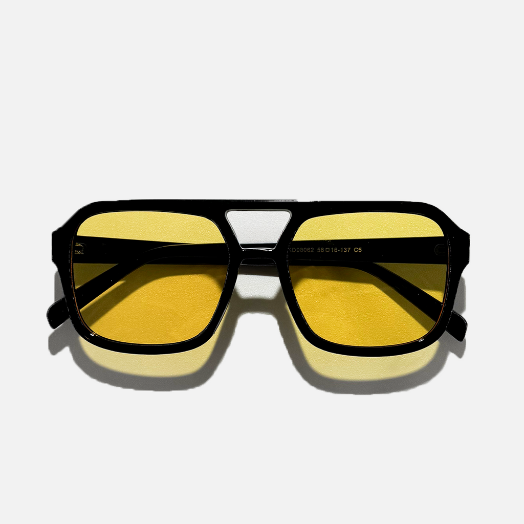 Amber pilot sunglasses with black polycarbonate frame and yellow lenses.