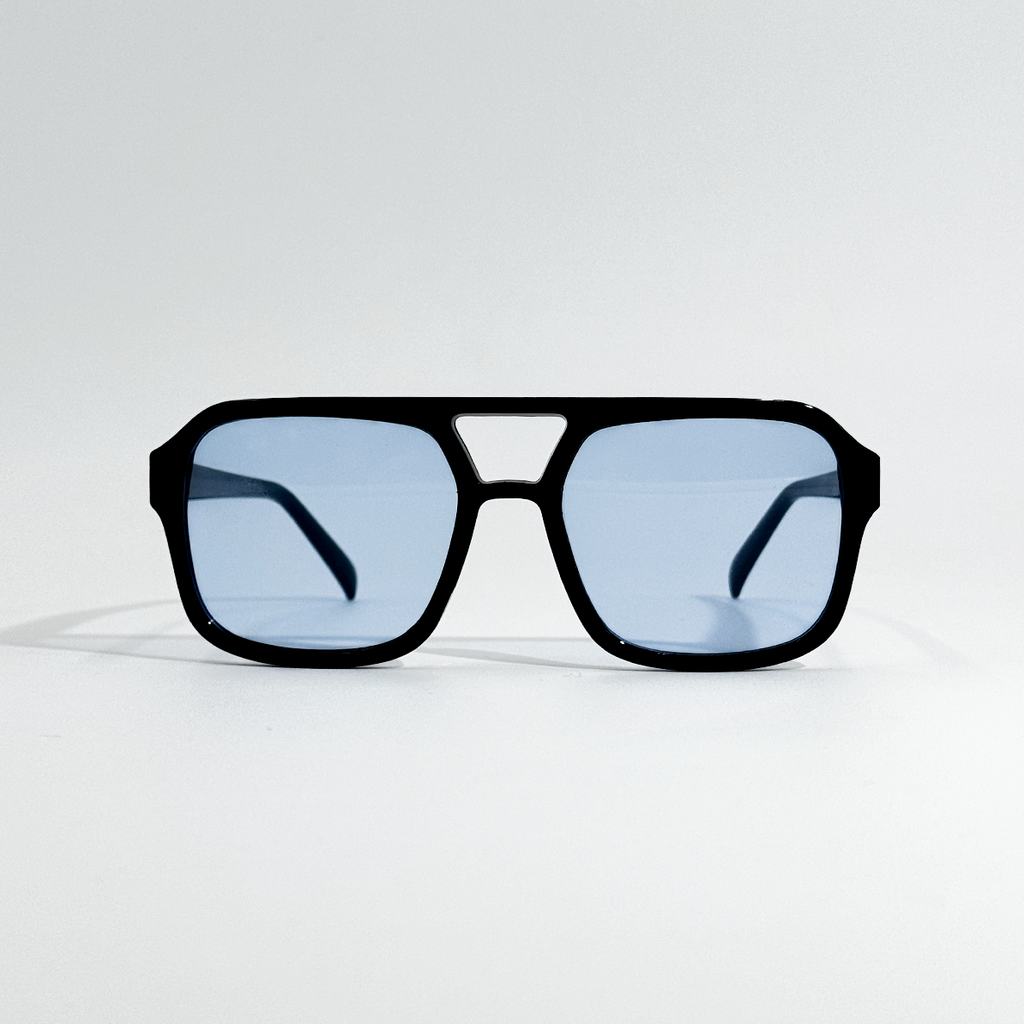 Arctic Noir retro sunglasses with black polycarbonate frame and light blue UV400 lenses.