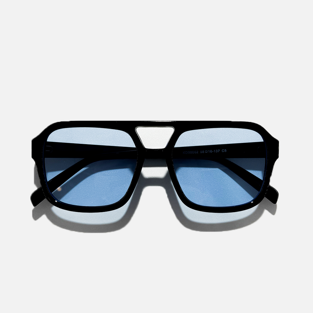 Arctic Noir black frame sunglasses with light blue lenses, retro style.