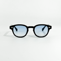 Black SS26 Circle Collection sunglasses with light blue gradient lenses and silver temple accents.