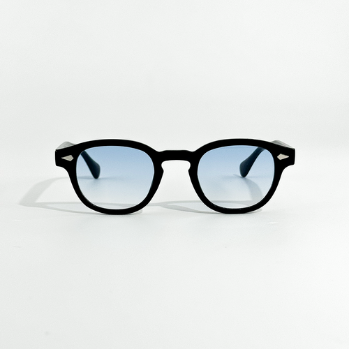 Black SS26 Circle Collection sunglasses with light blue gradient lenses and silver temple accents.