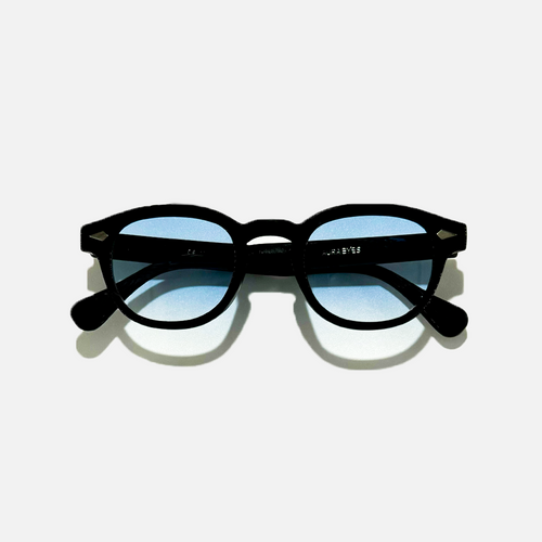 Azure Noir SS26 Circle Collection sunglasses with black frames and light blue UV 400 lenses.