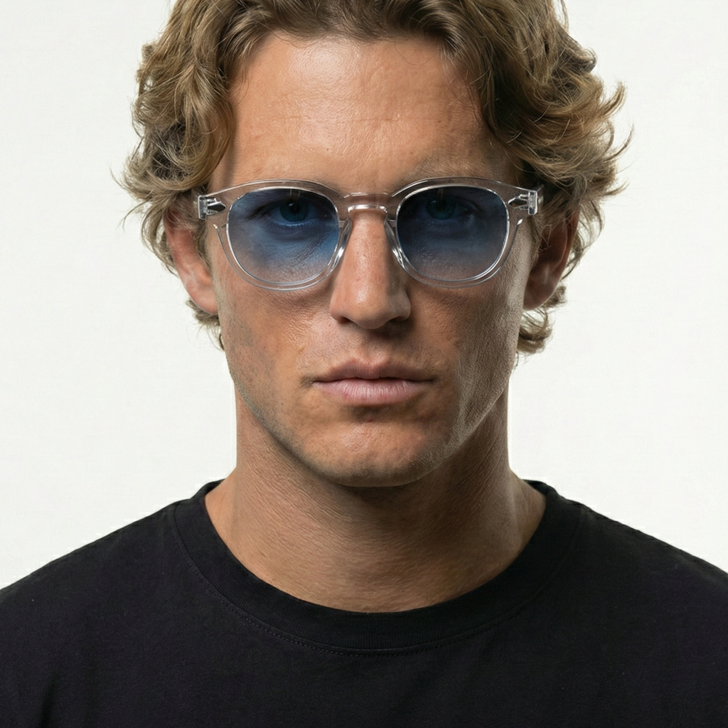 Man wearing Blue Clarity transparent frame sunglasses with blue gradient lenses.