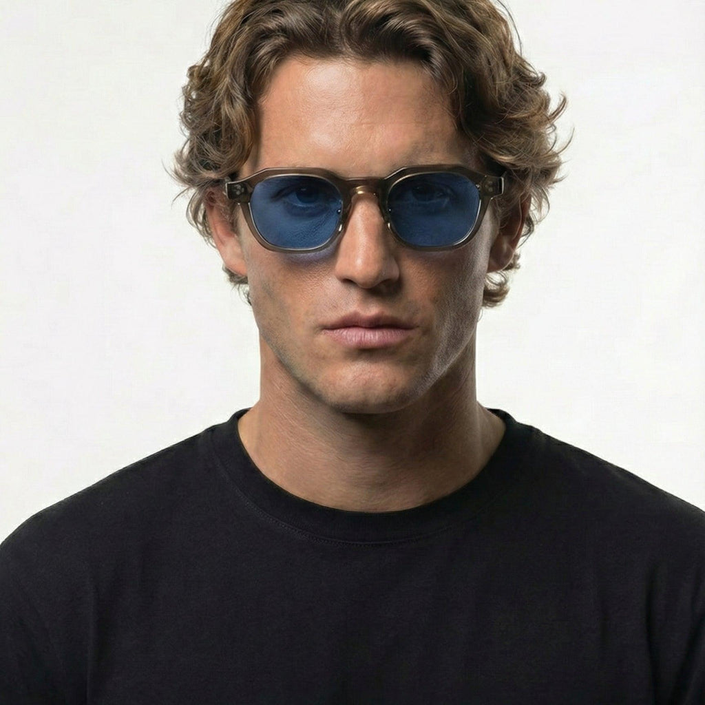 Man wearing Blue Mist Grey Crystal Frame Panto Sunglasses with blue UV400 lenses.