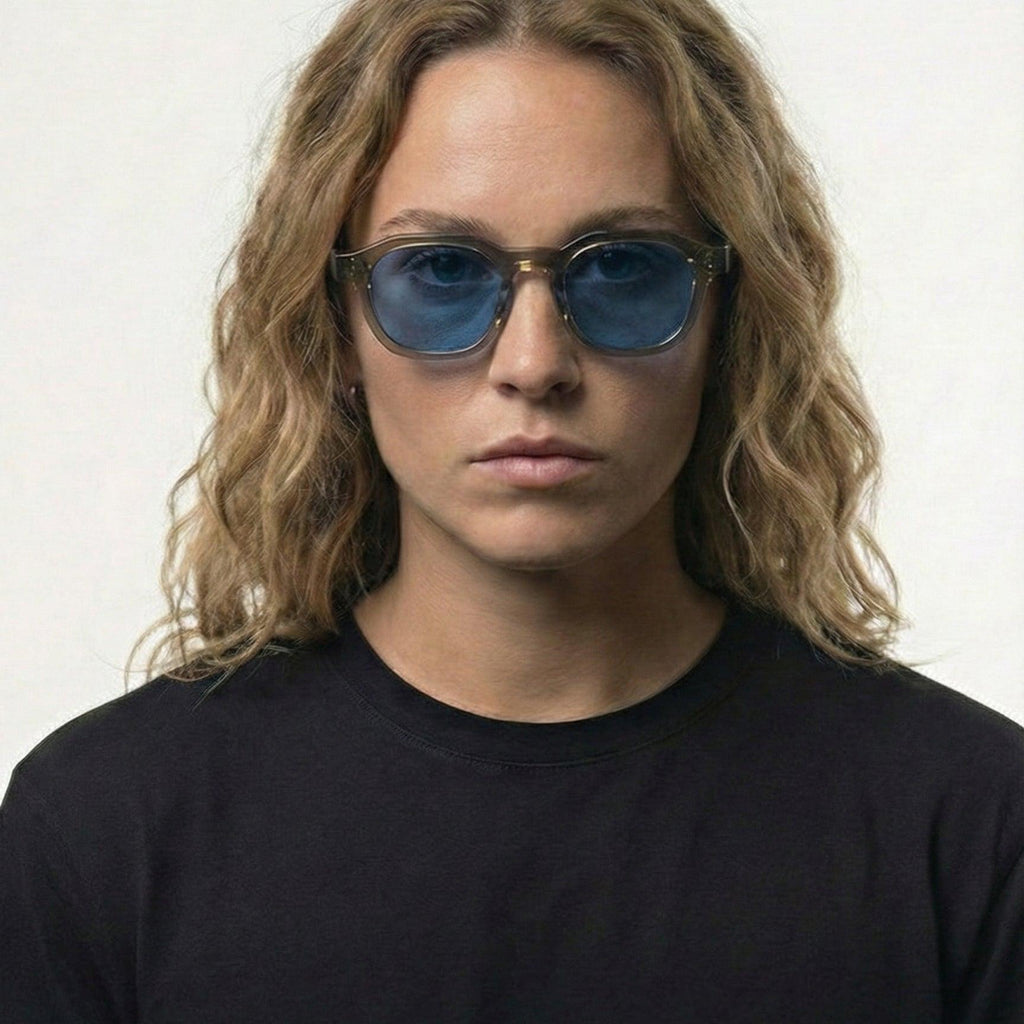 Woman wearing Blue Mist Grey Crystal Frame Panto Sunglasses with blue UV400 lenses.