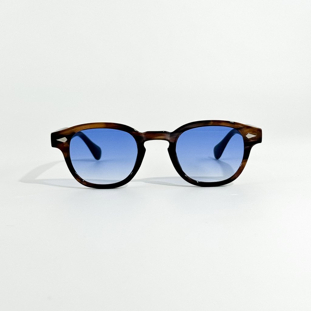 Blue Turtle SS26 Circle Collection sunglasses with dark blue lenses and a tortoiseshell frame.