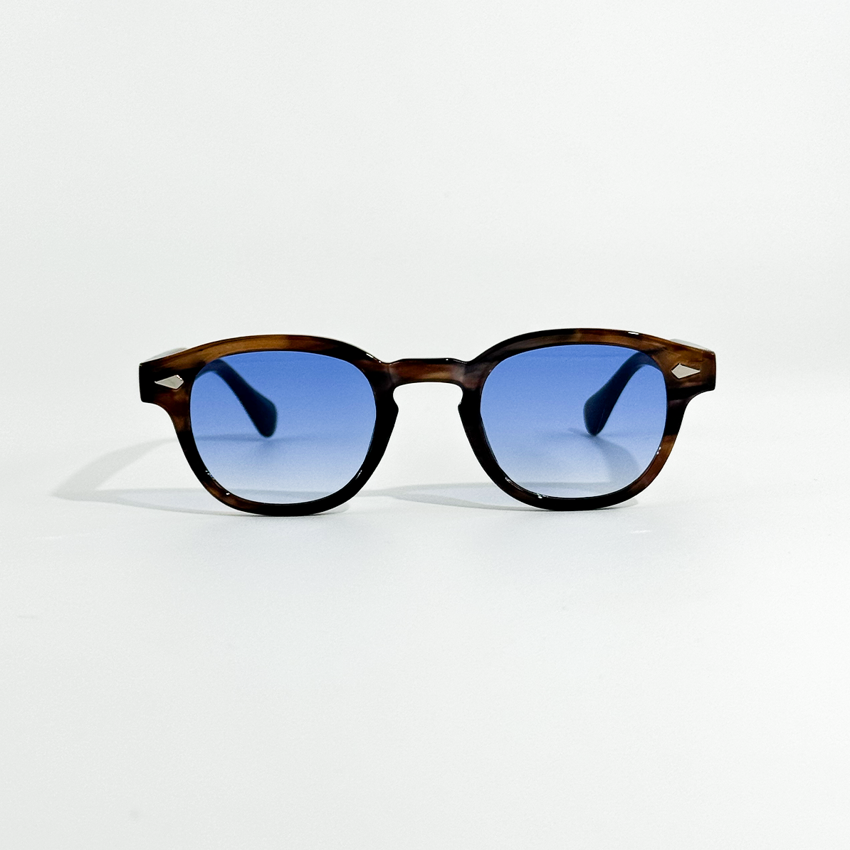 Blue Turtle SS26 Circle Collection sunglasses with dark blue lenses and a tortoiseshell frame.