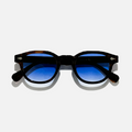 Blue Turtle SS26 Circle Collection sunglasses with dark blue gradient lenses and tortoiseshell frames.