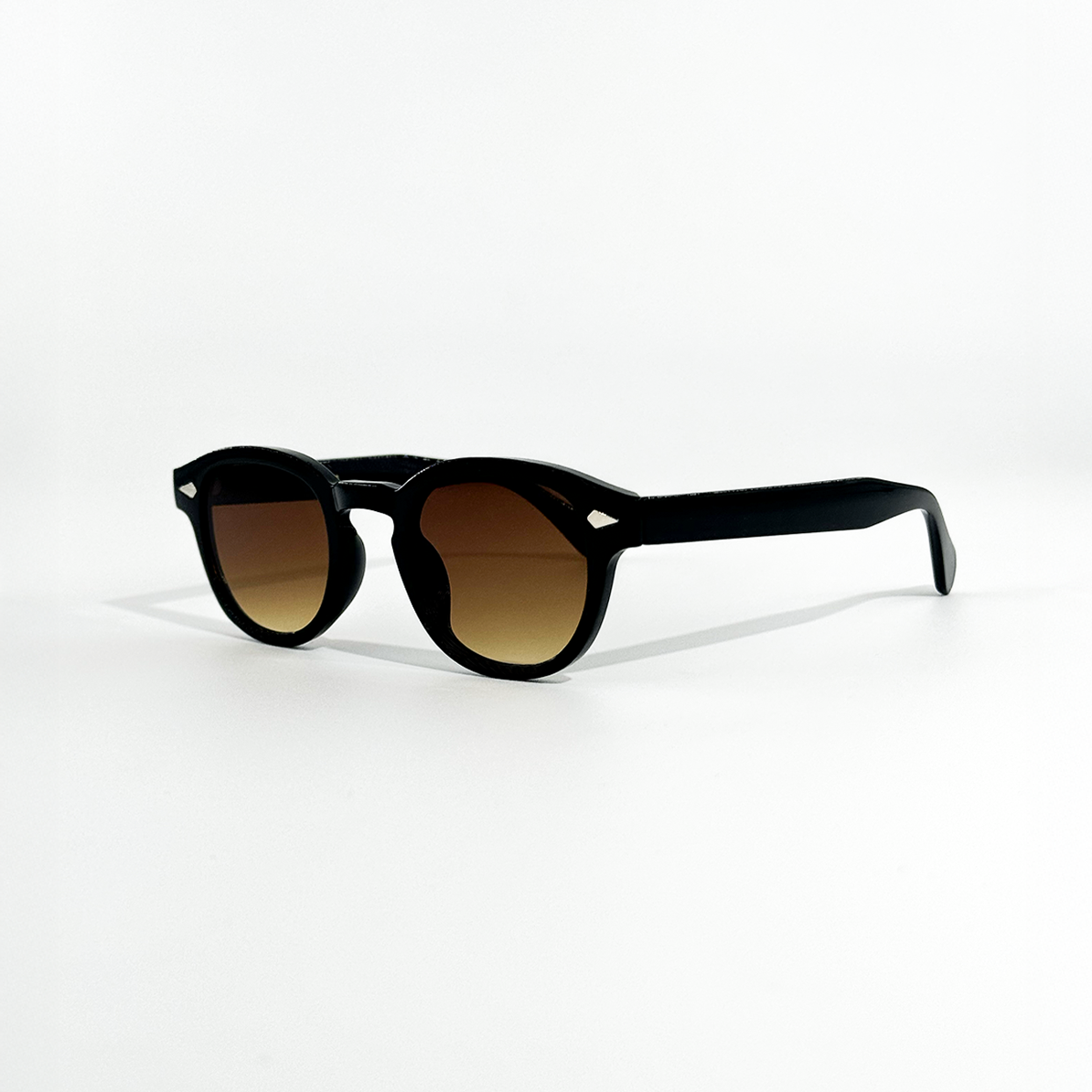 Choco Chic brown gradient sunglasses with black frames and round lenses, featuring UV 400 protection.
