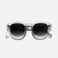 Crystal Tide transparent frame sunglasses with round black lenses, offering UV 400 protection.