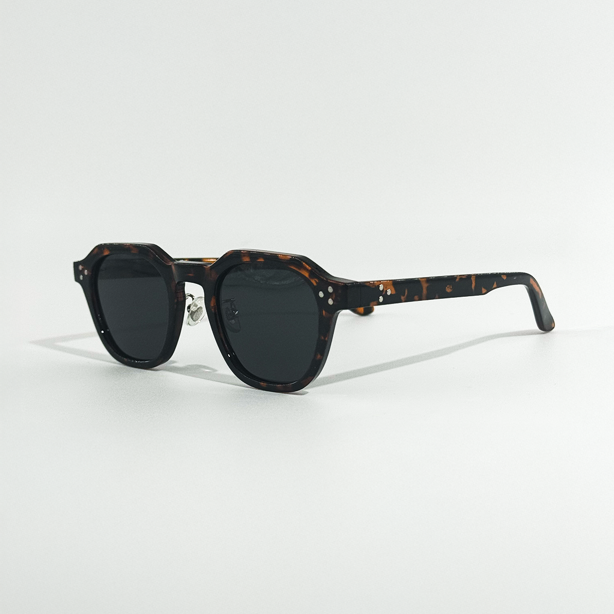Dark Havana frame sunglasses with black lenses, featuring a stylish, durable design.