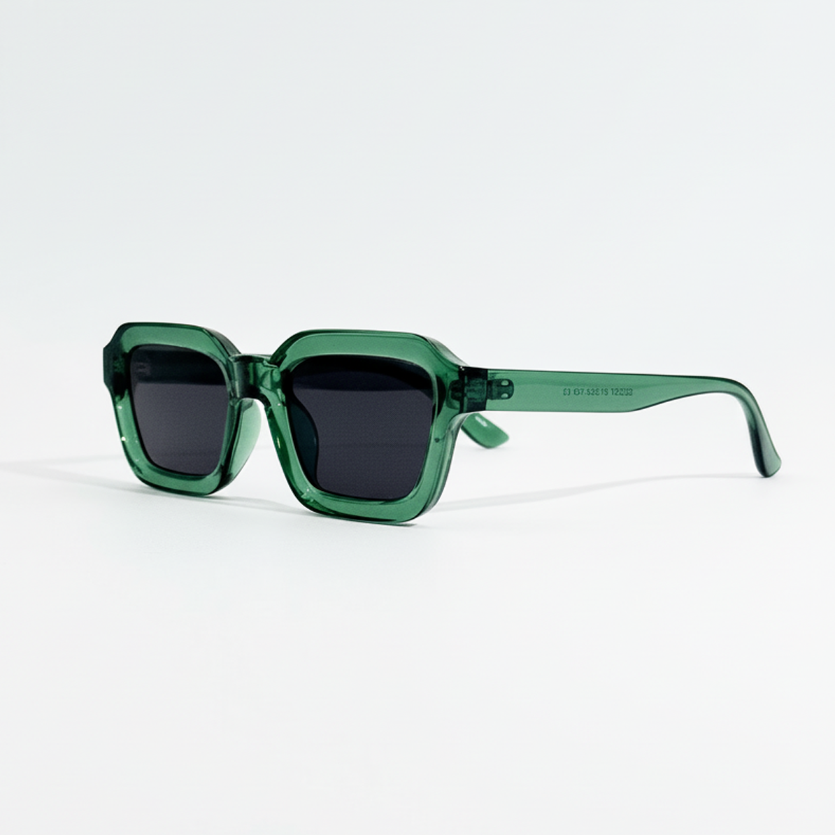 Emerald Tide green crystal frame sunglasses with dark lenses and UV400 protection.