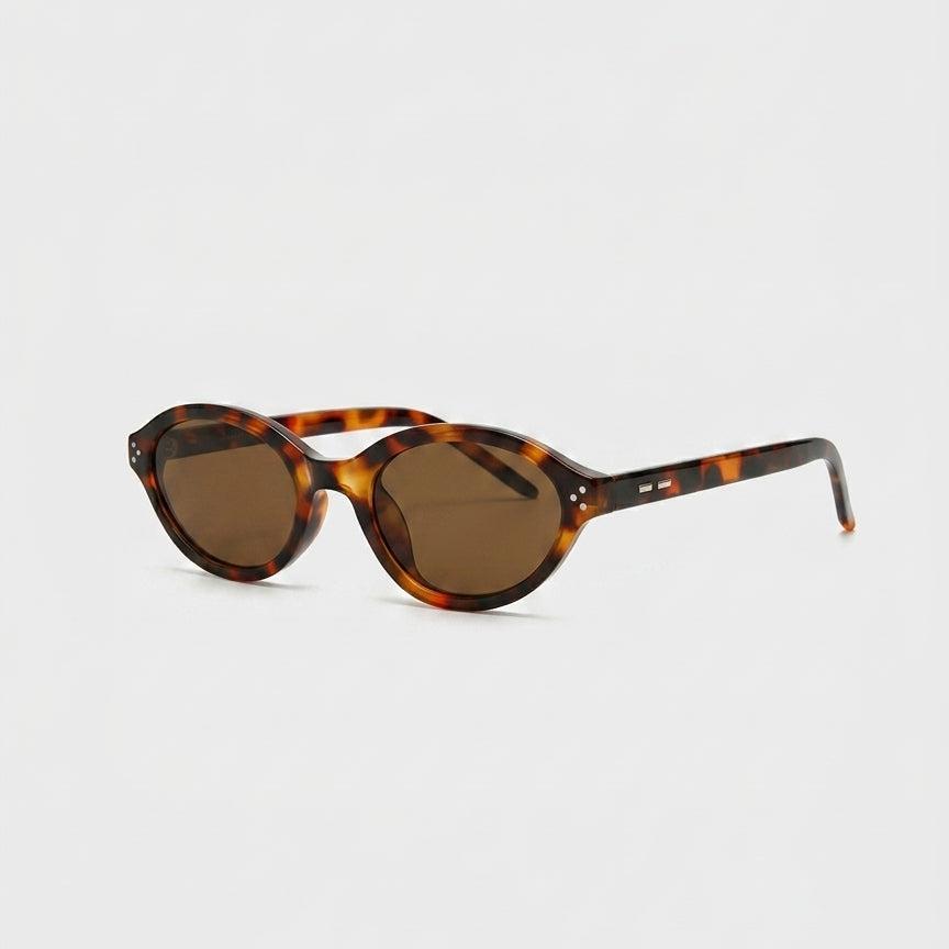 Havana Muse Dark Havana Brown Lens Oval Sunglasses with UV400 protection.