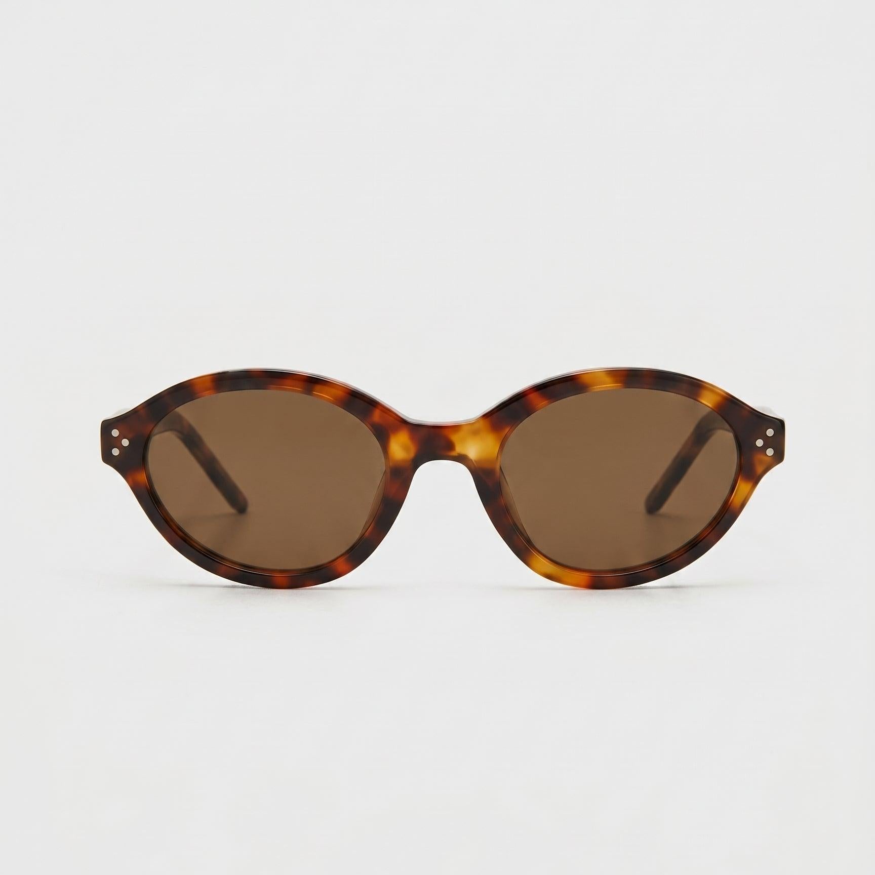 Havana Muse Dark Havana brown lens oval sunglasses with polycarbonate frame.