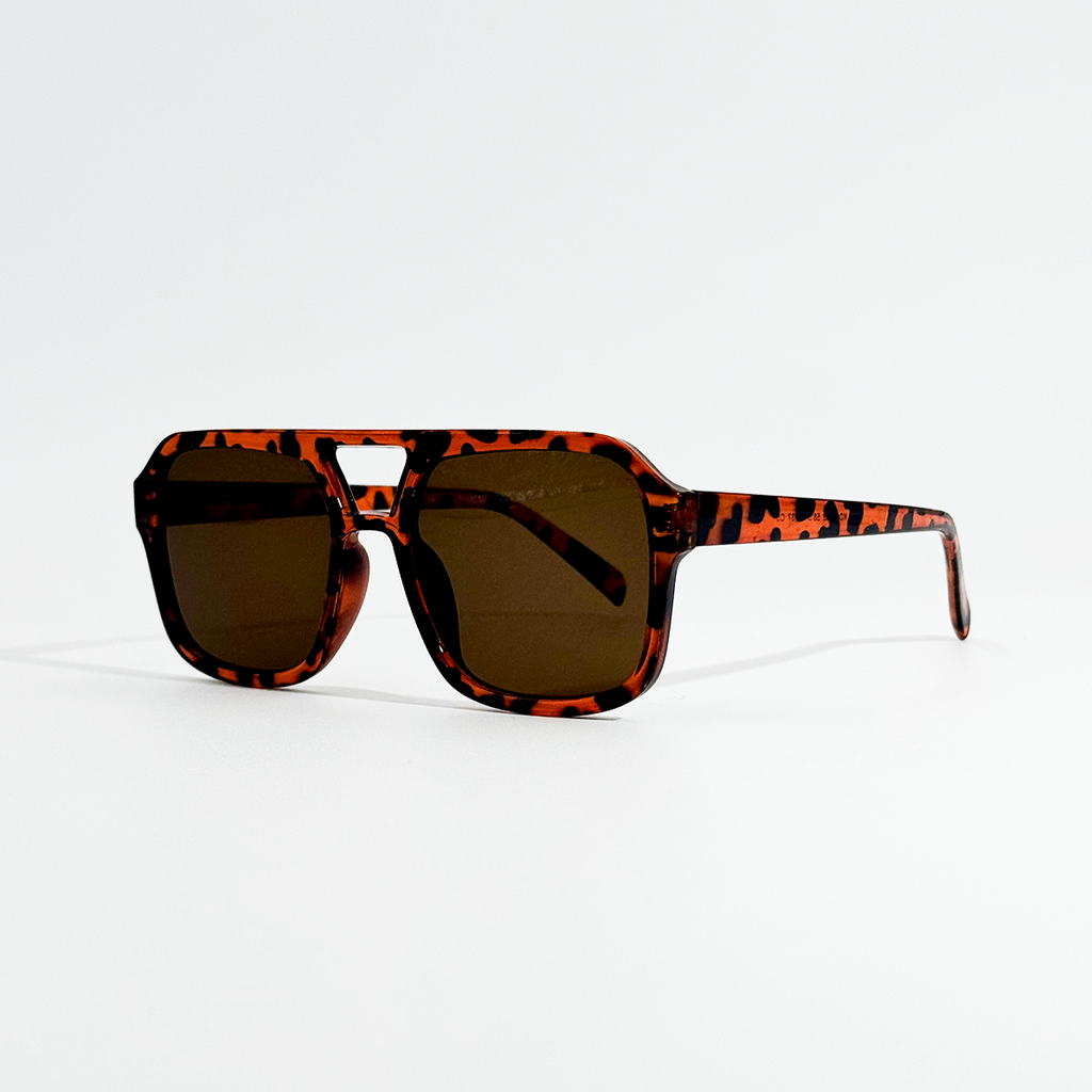 Havana pilot sunglasses with dark black lenses and a retro tortoise shell frame.