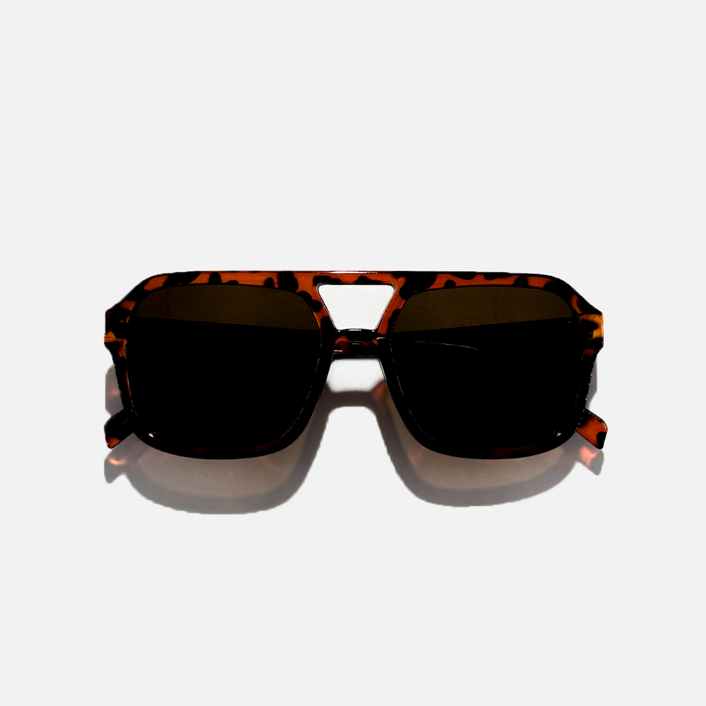 Havana pilot sunglasses with dark black lenses and a tortoise shell frame.