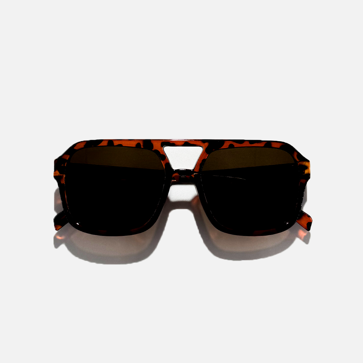Havana pilot sunglasses with dark black lenses and a tortoise shell frame.