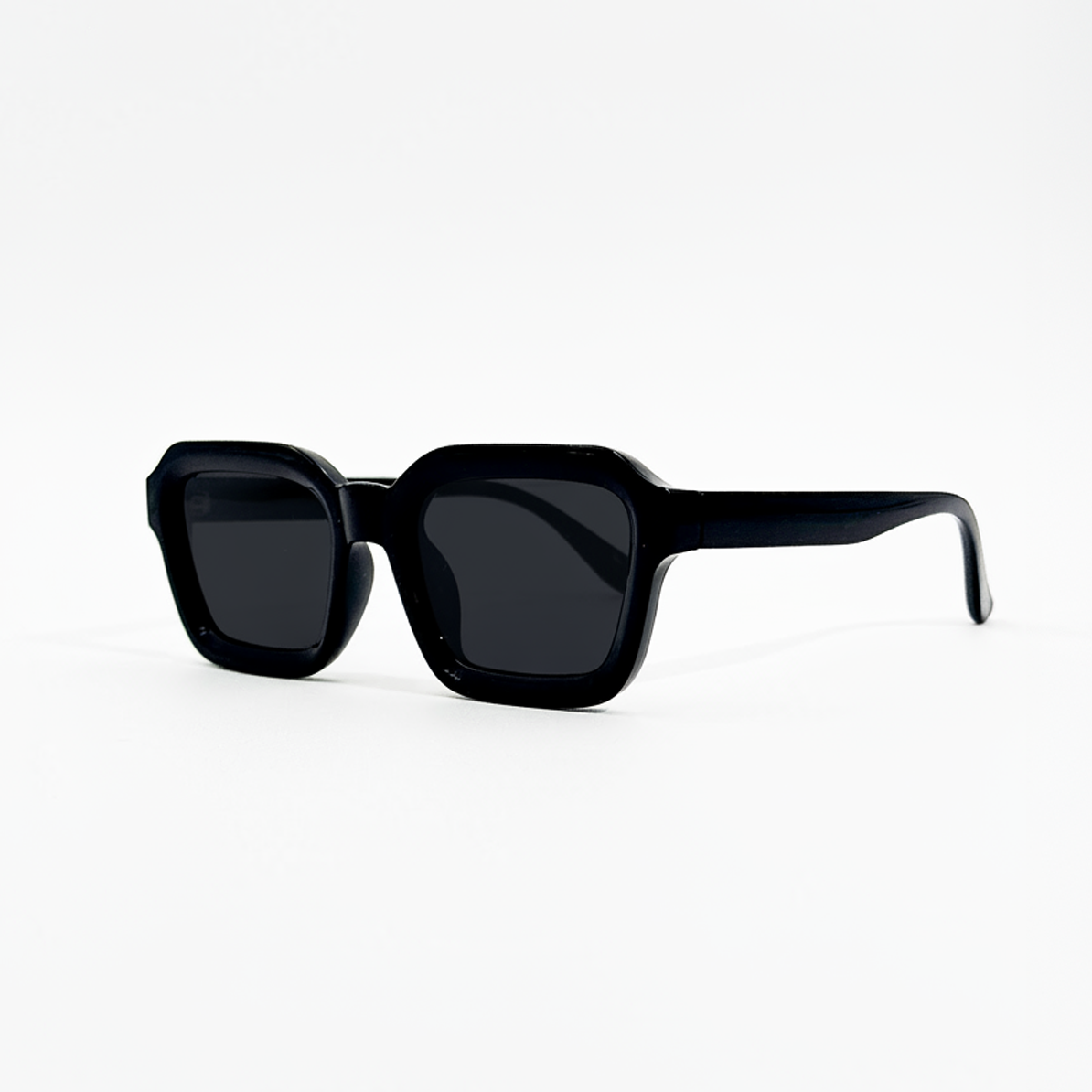 Midnight Noir black lens square sunglasses with thick frames and UV400 protection.