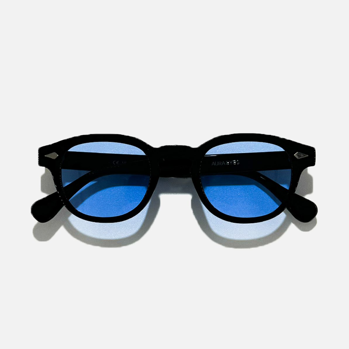 Black round frame sunglasses with mystical sky blue lenses, offering UV 400 protection.