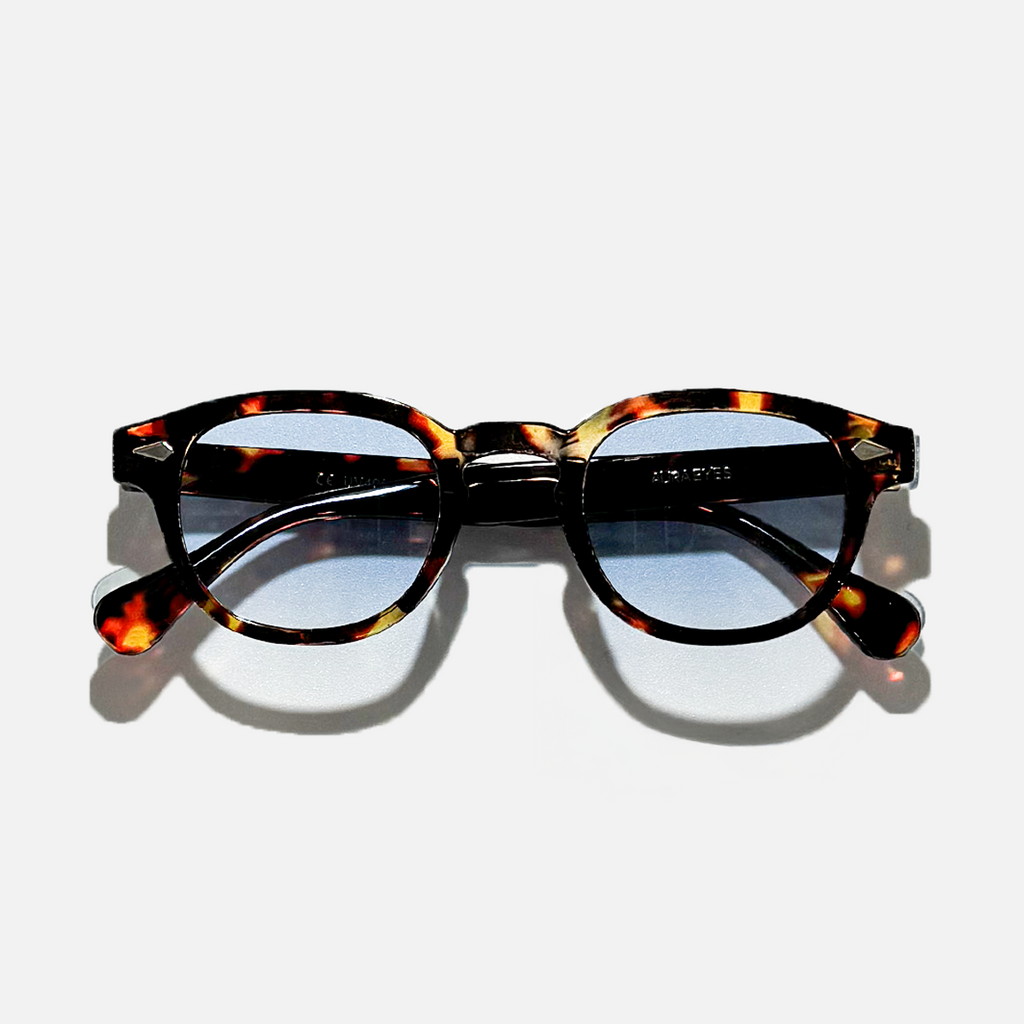 Tortoiseshell circle sunglasses with ocean amber blue gradient lenses, SS26 collection.