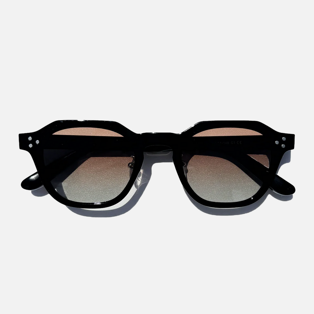Silver Shadow panto sunglasses with black frames and silver gradient lenses, top-down view.